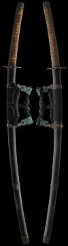 Tachi koshirae plated iron menuki Nihontoantiques.jpg